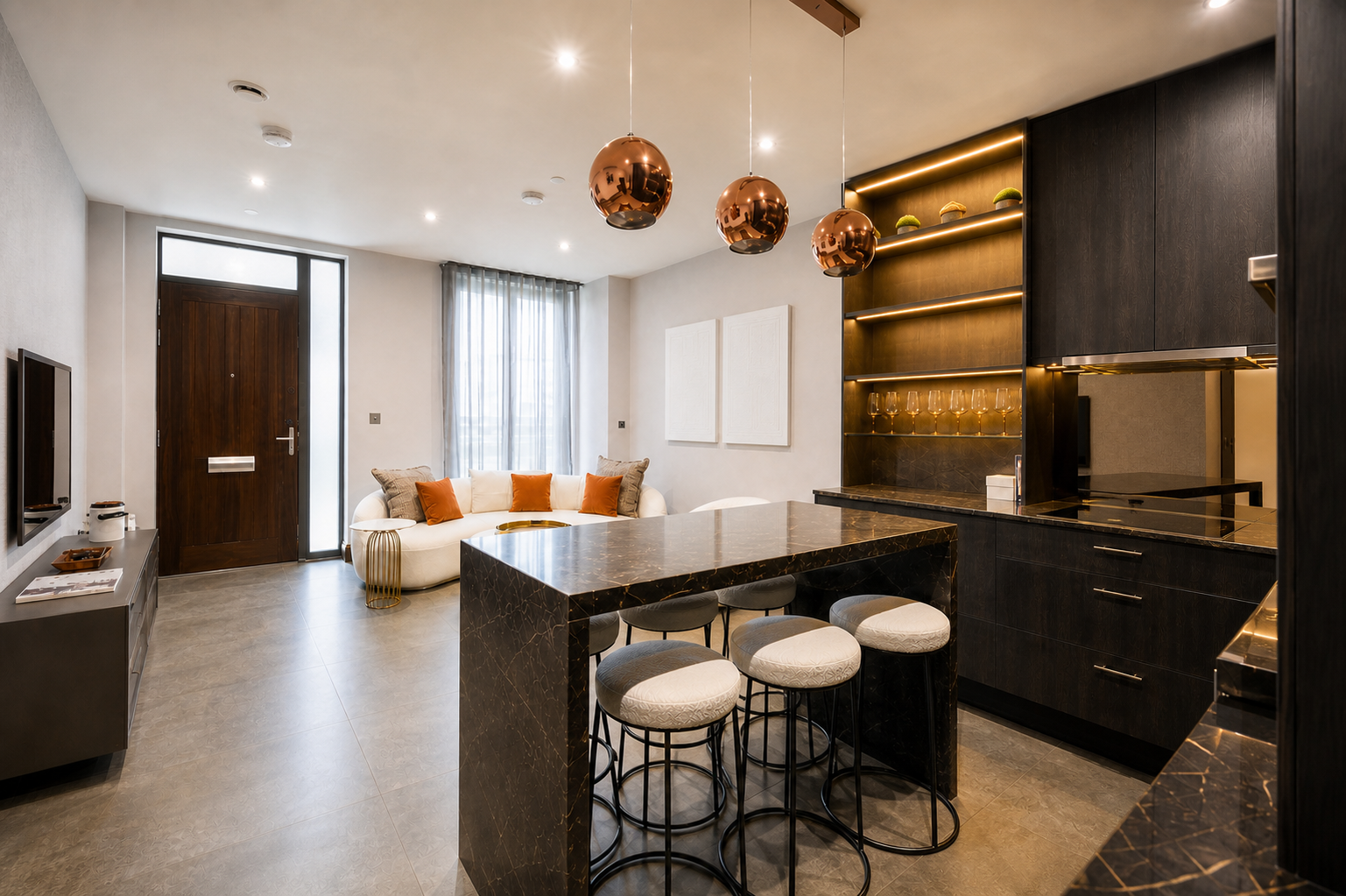 Open-plan Maida Vale apartment with a dark bespoke kitchen, marble island and sculptural white seating