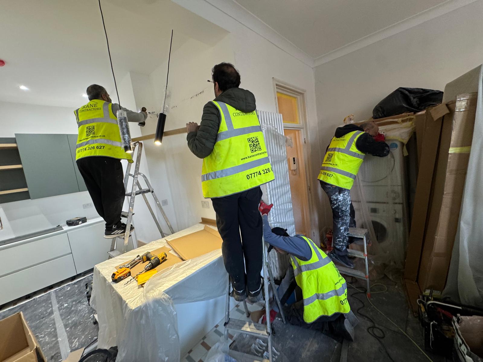 Kane Contractors team completing a London kitchen installation